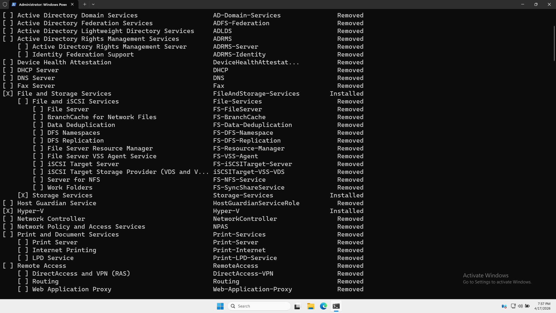 Console listing Windows Server roles and feature status (Installed/Removed) on a black terminal, e.g., File and Storage Services Installed, AD Domain Services Removed