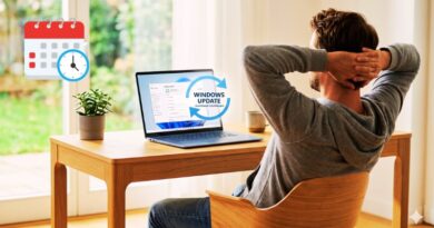Man relaxing at a wooden desk with a laptop showing a Windows Update notification; a calendar and clock icon float nearby.