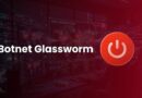 Cybersecurity banner: 'Botnet Glassworm' text with a red circular power icon on the right in a dark network operations center/screen wall.