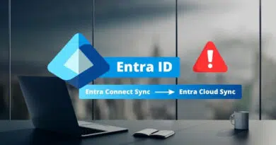 Entra ID branding with a blue banner reading 'Entra ID' and a secondary bar 'Entra Connect Sync → Entra Cloud Sync' on a modern office desk setup with a laptop and mug in the background, plus a red warning icon.