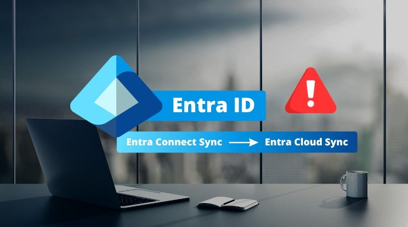 Entra ID branding with a blue banner reading 'Entra ID' and a secondary bar 'Entra Connect Sync → Entra Cloud Sync' on a modern office desk setup with a laptop and mug in the background, plus a red warning icon.