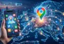 Hand holding a smartphone showing map icons as glowing routes over a world map with a bright location pin in the center.