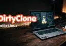 Promotional banner for DirtyClone Faille Linux: laptop with code on screen and penguin figurines on a wooden desk.