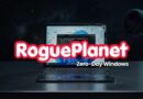 RoguePlanet branding across a cracked laptop screen on a starry space background with the caption 'Zero-Day Windows'