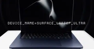 Laptop with a display showing 'DEVICE_NAME=SURFACE_LAPTOP_ULTRA' on a dark screen.