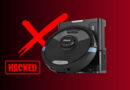 Robot vacuum with a bold red X and a HACKED stamp, signaling a security breach in a smart home device.