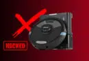 Robot vacuum with a bold red X and a HACKED stamp, signaling a security breach in a smart home device.