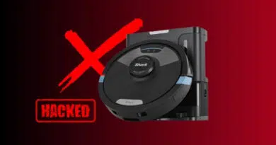 Robot vacuum with a bold red X and a HACKED stamp, signaling a security breach in a smart home device.