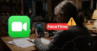 Person at a desk using a smartphone for video chat, with Zoom and FaceTime logos and a caution symbol in the foreground.