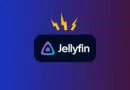 Jellyfin logo on a dark rounded badge with a purple-blue triangle icon and three yellow lightning bolts above on a blue–purple gradient background.