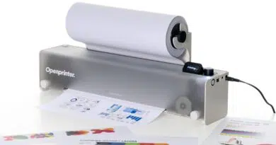 Open Printer: A Repairable, DRM-Free Open Source Printer Is Taking Shape Openprinter desktop printer with a roll of paper feeding through, printing sheets in front of it