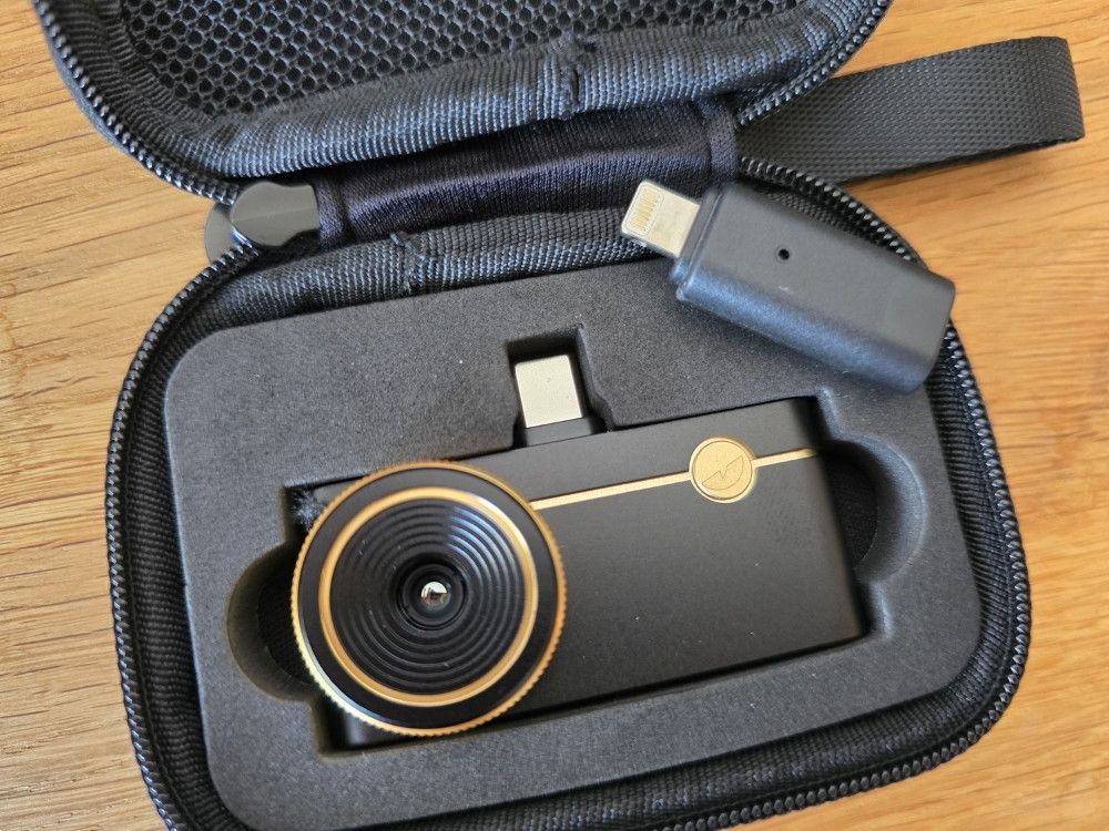 Thermal Master P3 stored in its carrying case with the Lightning adapter.