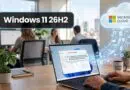 Office desk with a laptop displaying Windows 11 UI; label 'Windows 11 26H2' and a glowing Microsoft Cloud icon on the right.