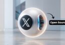 Futuristic white sphere with an X logo and glowing inner panel; an 'Open Source' label points at it.