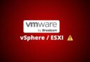VMware by Broadcom logo with vSphere/ESXi text and a yellow warning triangle on a red gradient background