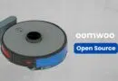 Illustrated robot vacuum cleaner with gray top and blue side panels, next to the brand name 'oomwoo' and a blue 'Open Source' button.