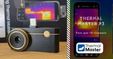 Close-up of a black dash cam with gold accents on a wooden surface; lens in view and USB-C port on top (left panel).