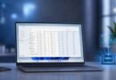 Laptop on a desk showing a data-management dashboard on screen, with a blue holographic NPU graphic and chart nearby.