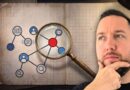 A man looks thoughtful while a magnifying glass highlights a red central node in a network diagram drawn in a notebook.